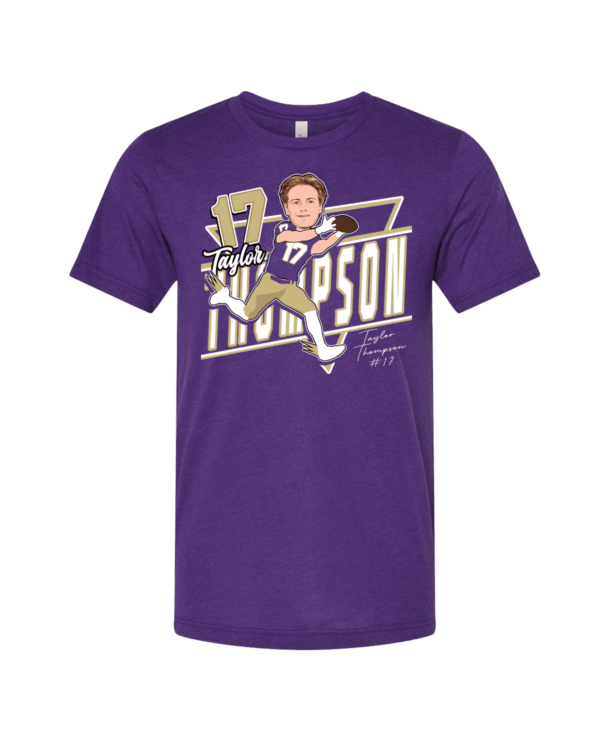 A purple t-shirt with an illustration of a person swinging a baseball bat.